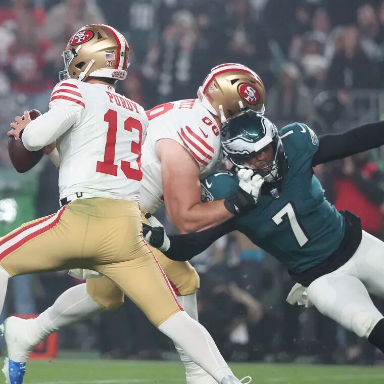 San Francisco 49ers quarterback Brock Purdy looks for a receiver as offensive tackle Colton McKivitz blocks Eagles linebacker Haason Reddick in the first quarter on Sunday, December 3, 2023 in Philadelphia.