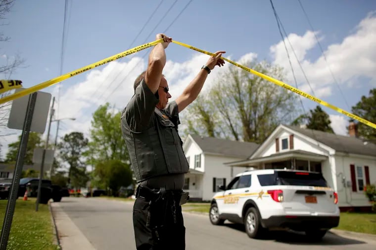 Law enforcement investigate the scene of a shooting in Elizabeth City, N.C.