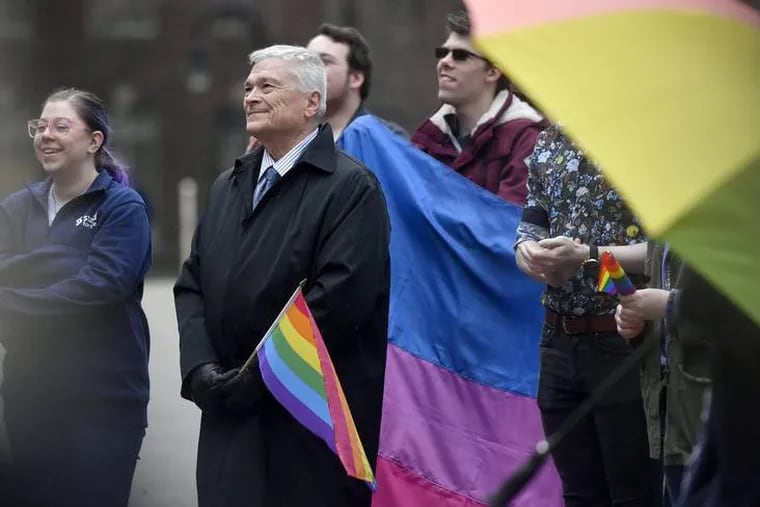 Penn State president Dr. Eric Barron smiled as he listened to individuals speak at the Penn State LGBTQA Student Resource Center pride rally on April 5, 2019.