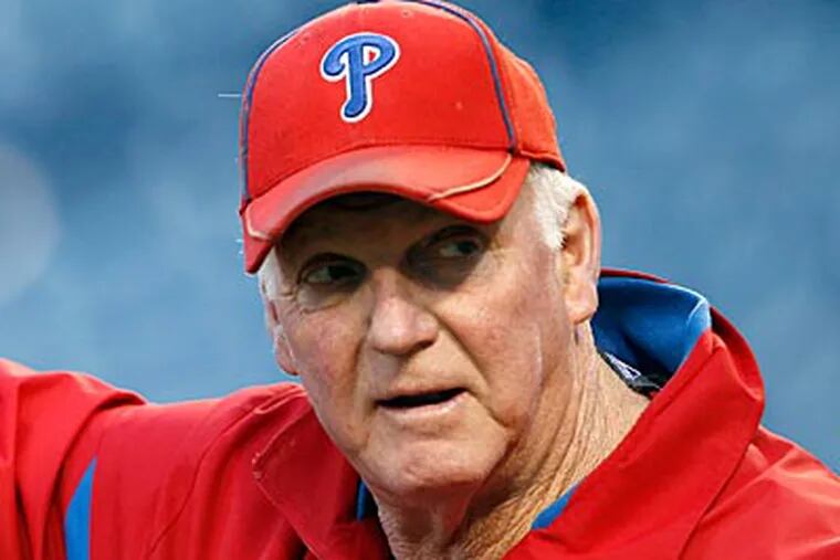 Charlie Manuel and the rest of the Phillies coaching staff will return in 2012. (Yong Kim/Staff Photographer)