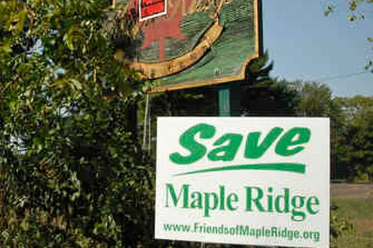 A Friends of Maple Ridge signat the former golf club urges thatthe 112-acre site be preserved.
