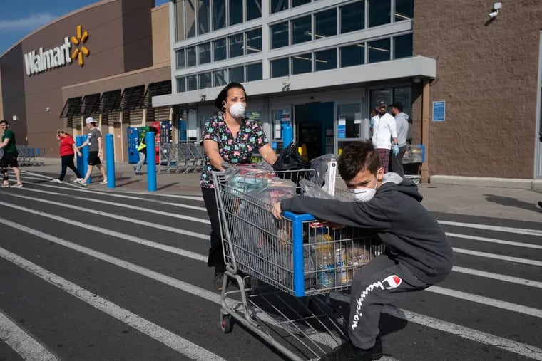 Jessica Torres Terreforte, a Certified Nursing Assistant, and her son Daniel Terreforte, in the parking lot of Walmart located at the Philadelphia Mills Shopping Center.