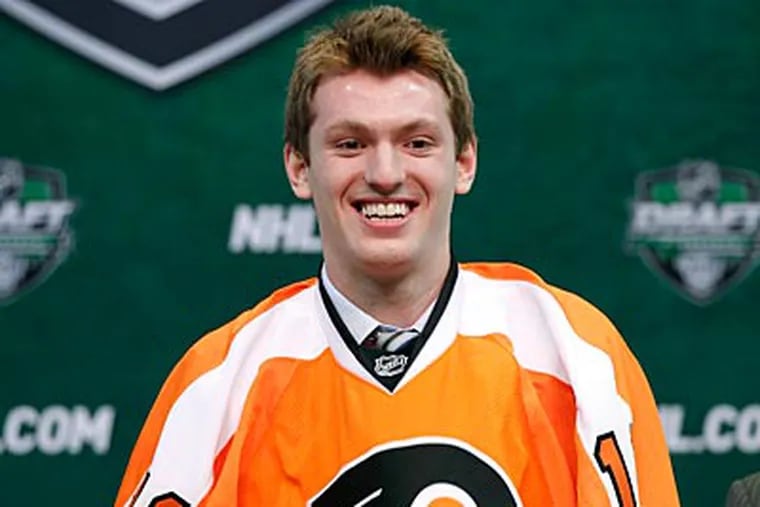 Sean Couturier was selected by the Flyers with the No. 8 pick in the NHL Entry Draft. (Andy King/AP)