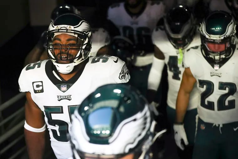 Eagles defensive end Brandon Graham (left) shouts before taking the field against the Cardinals on Dec. 20.