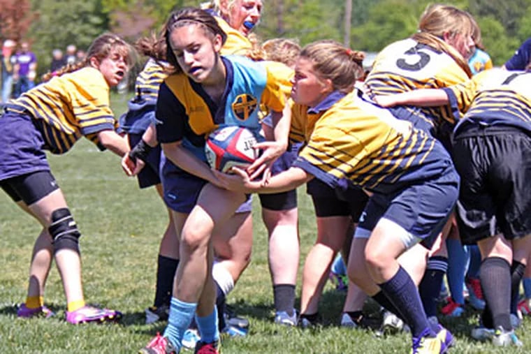 Downingtown Rugby Football Club's Taylor Jones emerges with the ball after a scrum during a match against Media United on April 29. (Lou Rabito/Staff)
