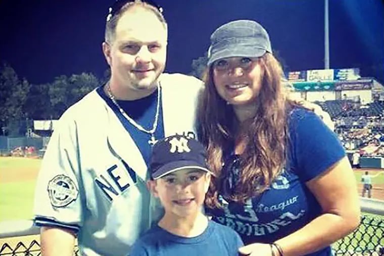 Jerome Iozzia, 50, stands with his 11-year-old son, Nico and fiancé, Jasmine Rodriguez, 37, each of them sporting New York Yankees wear. (photo via instagram)