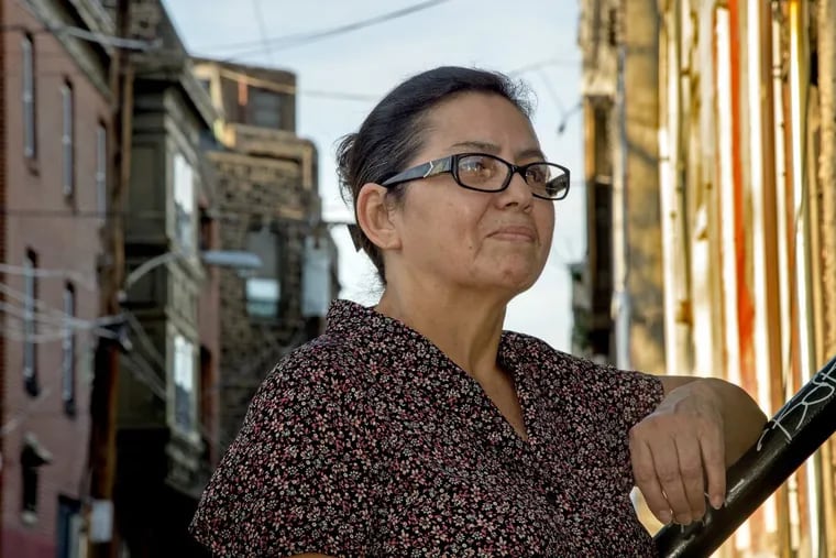 Miriam Turcios, originally from Honduras, pauses outside the Kensington offices of New Sanctuary Movement of Philadelphia. The Trump administration revoked the Temporary Protected Status that allows Turcios and others to live and work here legally.
