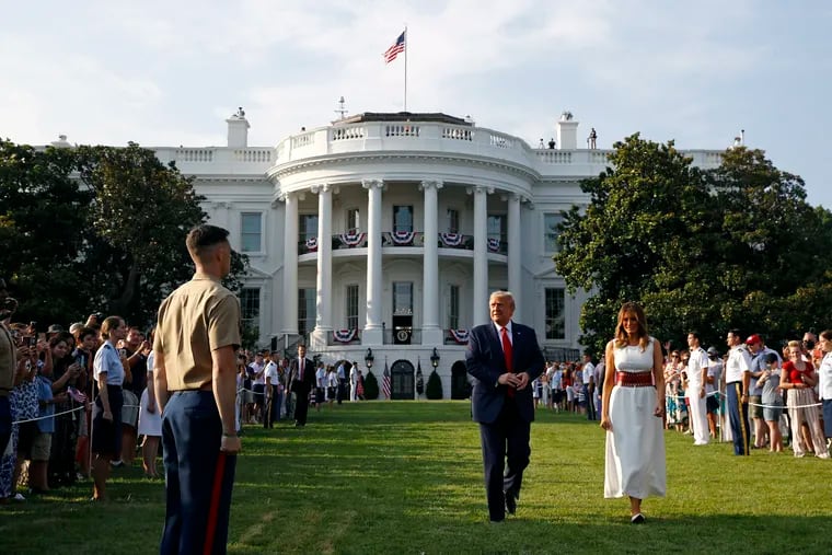 President Donald Trump and first lady Melania Trump walk on the South Lawn of the White House during a "Salute to America" event, Saturday, July 4, 2020, in Washington. (AP Photo/Patrick Semansky)