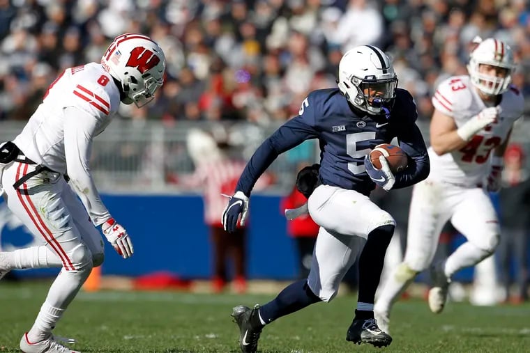 Penn State's Jahan Dotson (5) takes off running after a catch in a game against Wisconsin last season.