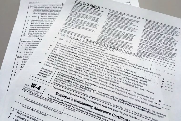 This Feb. 1, 2018 file photo shows an IRS W-4 form.