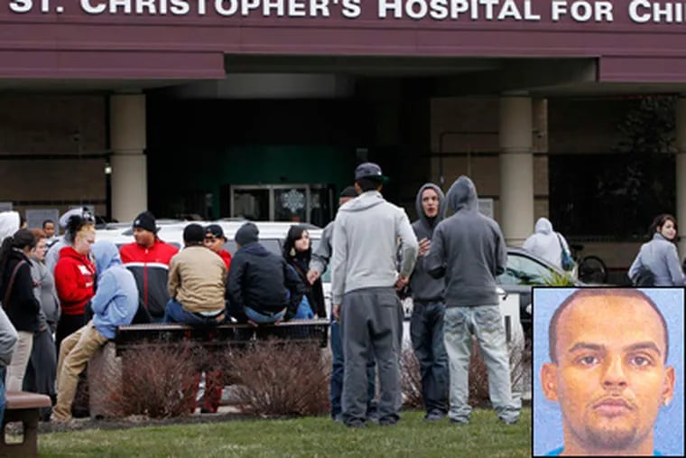 Young people gather outside St. Christophers Hospital for Children Wednesday morning in support of a friend who was clinging to life after being shot in a car in Juniata Park. Axel Barreto, (inset), is charged in the shootings. (Allejandro A. Alvarez / Staff Photographer)