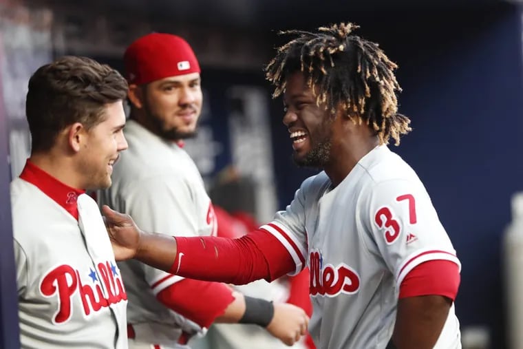 Rhys Hoskins thinks it’s important that Odubel Herrera (right) continue to be his fun-loving, aggressive self despite Monday’s mistakes.