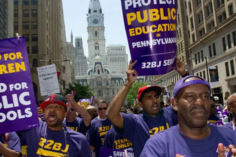 Members of the service Employees International Union Local 32BJ joined other blue collar union members of the School District of Philadelphia in a noon protest march up N. Broad St. to the School Administration Building Wednesday, May 23, 2012. (Clem Murray / Staff Photographer)