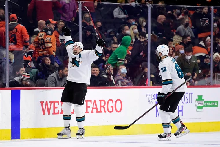 San Jose Sharks' Tomas Hertl, left, celebrates after scoring the game wining goal in overtime against the Flyers