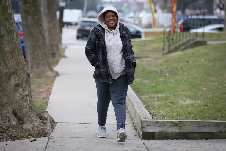Priscilla Odor get exercise by taking a walks around her neighborhood. She is pictured near her home in Philadelphia, Pa. on January 14, 2021.