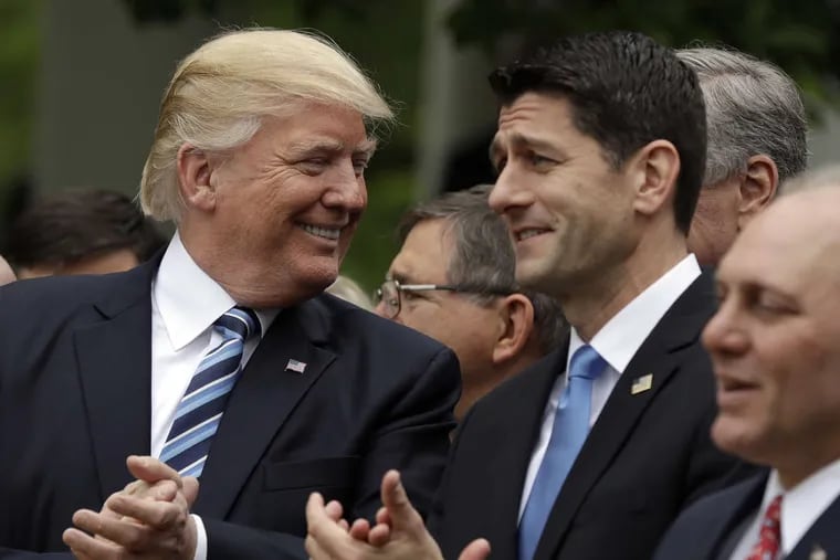 President Donald Trump (left) speaks with Speaker of the House Paul Ryan (R, Wisc.) in the Rose Garden of the White House after the House passed a plan to repeal and replace the Affordable Care Act earlier this month.