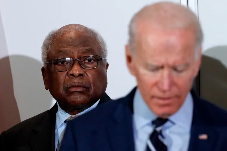 House Majority Whip Jim Clyburn (D., S.C.) (background) listens as Democratic presidential candidate Joe Biden speaks at a Feb. 26, 2020, event, where Clyburn endorsed him in North Charleston, S.C., considered to be a turning point in propelling Biden's victory.