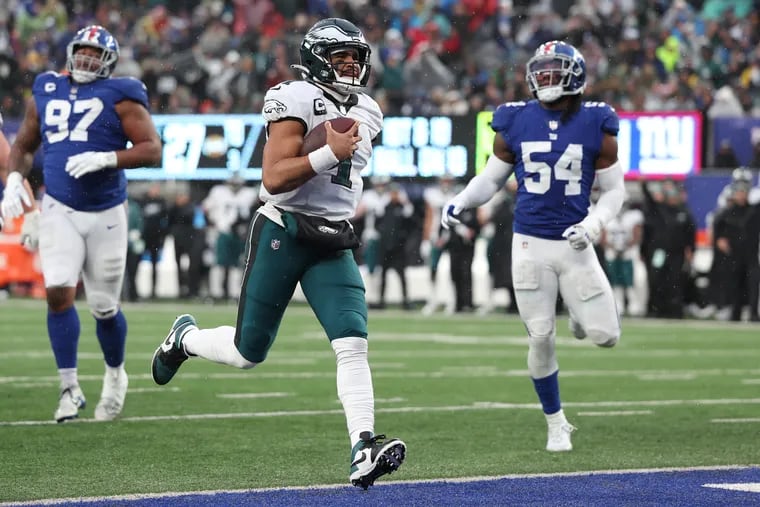EAST RUTHERFORD, NEW JERSEY - DECEMBER 11: Jalen Hurts #1 of the Philadelphia Eagles runs the ball for a touchdown during the third quarter against the New York Giants at MetLife Stadium.