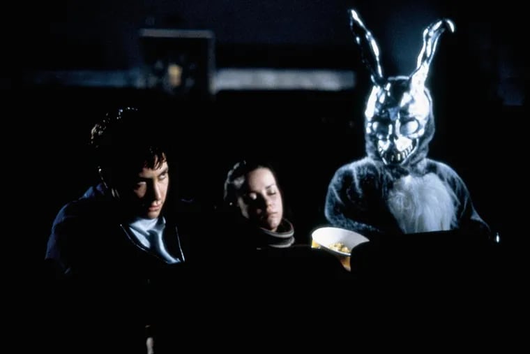 Jake Gyllenhaal, left, and Jena Malone, center, star in &quot;Donnie Darko.&quot; The movie has earned a cult following, especially among teens.