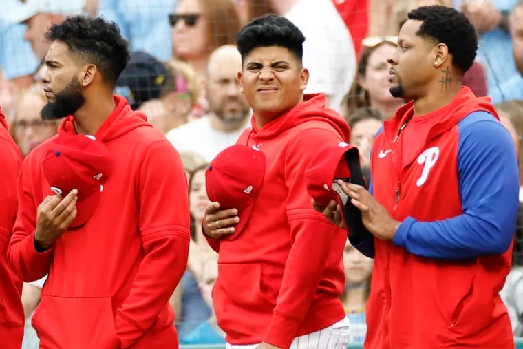 Phillies pitcher Ranger Suárez (center) said the swelling in his bruised left hand went down Sunday after getting hit by a line drive one night earlier.