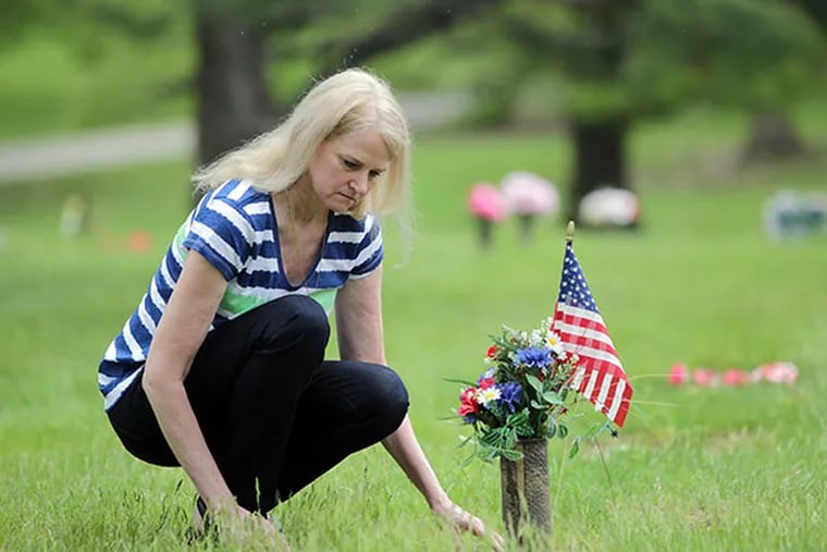 Jeanne Sides Sewell visits the grave of her husband, Thomas Sewell, at Valley Forge Memorial Gardens in King of Prussia, Pa. on May 12, 2014. ( DAVID MAIALETTI / Staff Photographer )