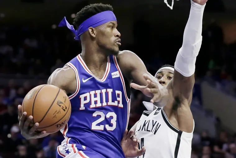 Jimmy Butler looks to pass around Rondae Hollis-Jefferson during the Sixers' win over the Nets last month.
