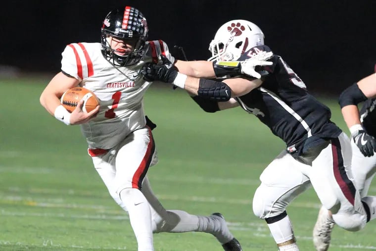 Ricky Ortega (left), of Coatesville tries to break away from Garnet Valley's Tom Deaver in the 2017 District 1 Class 6A, championship game.
