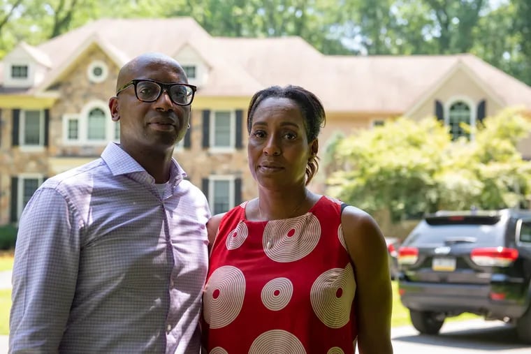 Rodney and Angela Gillespie stand in the driveway of their Chadds Ford home.