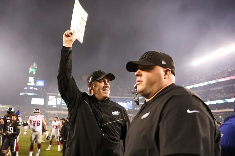 Eagles head coach Doug Pederson waves to the crowd after Monday night's overtime win over the New York Giants at Lincoln Financial Field.