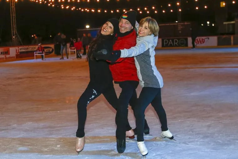 Olympic skaters (from to right):Tai Babilonia, Randy Gardner, and Dorothy Hamill stop to pose for a photograph during a family skate at the Wilmington Riverfront Rink promoting their play “Go Figure.”