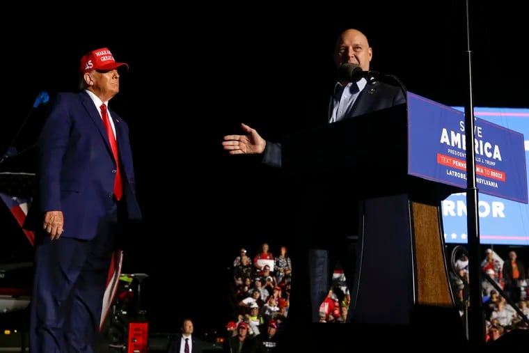 Pa. Republican gubernatorial nominee Doug Mastriano addresses a rally alongside former President Donald Trump in Latrobe on Nov. 5.