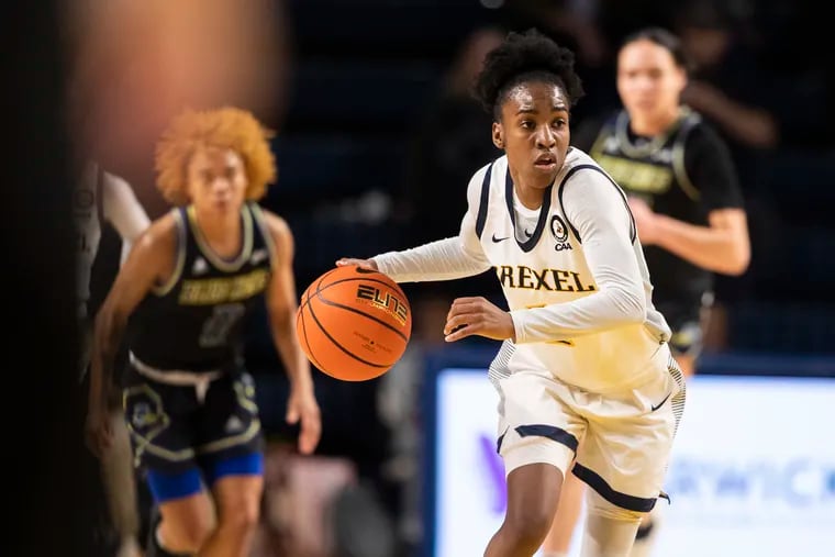 Keishana Washington of Drexel drives up court against Delaware during the 2nd half in January.