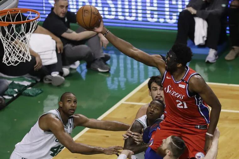 Sixers center Joel Embiid may need to take more shots from the perimeter in Game 2 to combat Boston’s defense.