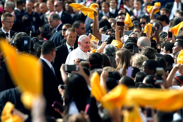 Pope Francis is welcomed at Our Lady Queen of Angels School, set amid public housing in the heavily Hispanic neighborhood of East Harlem.