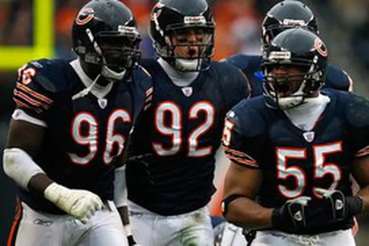 Donovan McNabb for linebacker Lance Briggs? You never know. Briggs (right), shown with Alex Brown (left) and Hunter Hillenmeyer, does not want to return to the Bears, who could be looking for a QB.