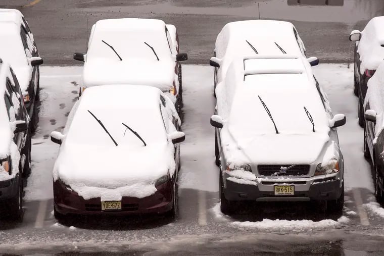 Leaving before the snow comes, morning commuters leave their windshield wipers up at PATCO's Westmont Station in Haddon Township before the last winter storm hit on Friday.