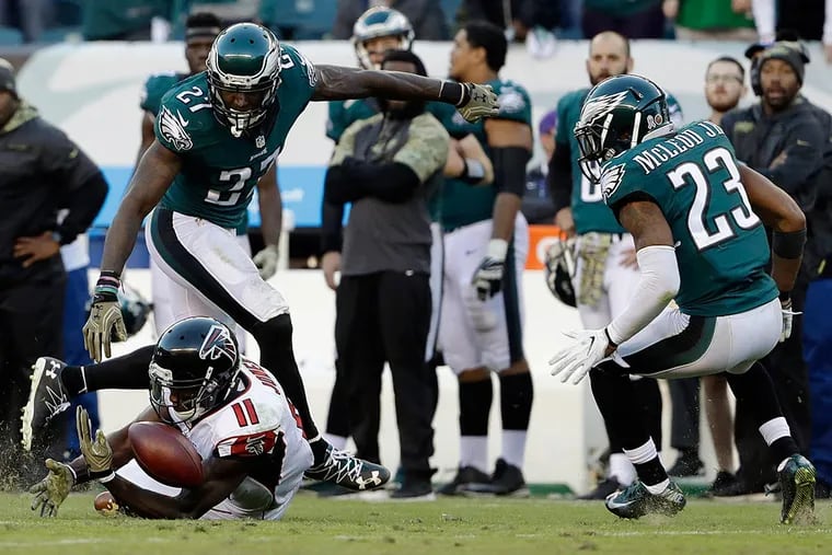 Atlanta Falcons' Julio Jones (11) cannot catch a pass as Philadelphia Eagles' Malcolm Jenkins (27) and Rodney McLeod (23) defend during the second half of an NFL football game, Sunday, Nov. 13, 2016, in Philadelphia.