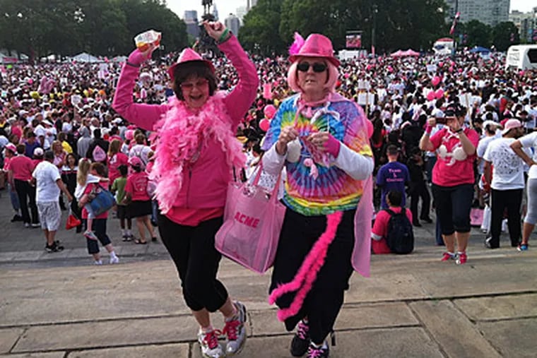 Liz Wilensky, of Stewartsville, N.J. and Kathy Clinton, of Kunkeltown, Pa., members of the Sole Sistas dance at the top of the Art Museum steps as the Race for the Cure gets underway. (Daniel Rubin/Staff)