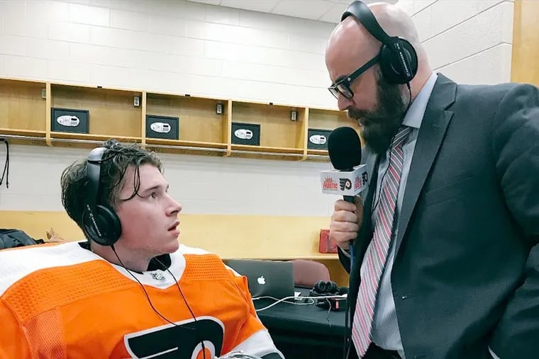 Jayson Myrtetus (right), seen here interviewing Philadelphia Flyers goalie Carter Hart, was laid off by 97.5 The Fanatic following Thursday's show.