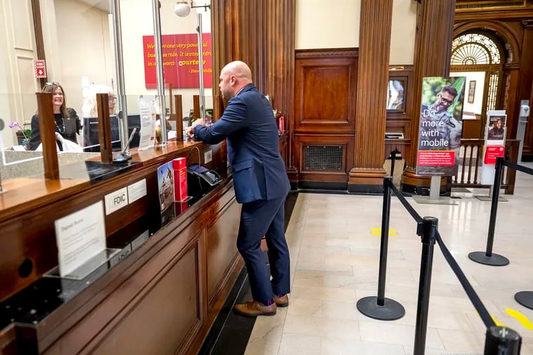 John Zimmerman visits the Wells Fargo bank branch in downtown Moorestown. He started as a part-time teller 23 years ago and now is the regional director, so he knows well how jobs in banking have changed in the past few decades, particularly at bank branches.