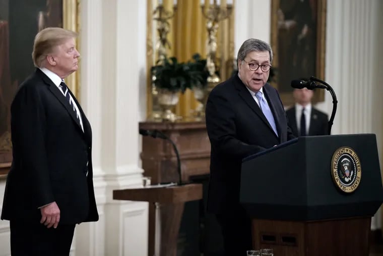 President Donald Trump stands with Attorney General William Barr before the presentation of the Public Safety Officer Medals of Valor in the East Room of the White House May 22, 2019 in Washington. (Olivier Douliery / Abaca Press / TNS)