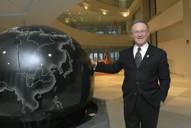 In this Jan. 14, 2009 photo, Moshe Porat, dean of the Fox School of Business and Management at Temple University, poses in the atrium of Temple's Alter Building in Philadelphia. Porat has been forced out at dean over falsified data submitted to rankings organizations about the school's online master's program. Temple President Richard Englert said in an email to the university community that Porat was asked to resign on Monday, July 9, 2018. Porat refused, but the university said he no longer heads the school. He still retains a teaching appointment. (April Saul/The Philadelphia Inquirer via AP)