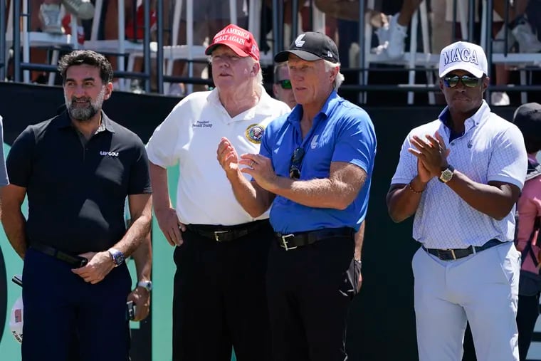 Yasir Al-Rumayyan, governor of Saudi Arabia's Public Investment Fund, left, former President Donald Trump, second from left, Greg Norman, LIV Golf CEO, third from left, and Majed Al-Sorour, CEO of Golf Saudi, watch the start of the second round of the Bedminster Invitational LIV Golf tournament in Bedminster, N.J., July 30, 2022.