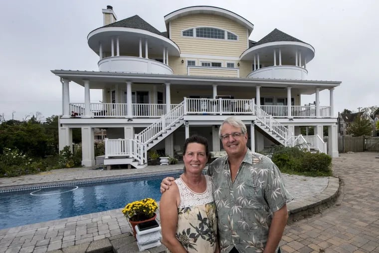 Carol and Mike Savage, both 65, in front of their newly rebuilt house in Tuckerton. Their old house, a rancher, was destroyed by Hurricane Sandy five years ago.