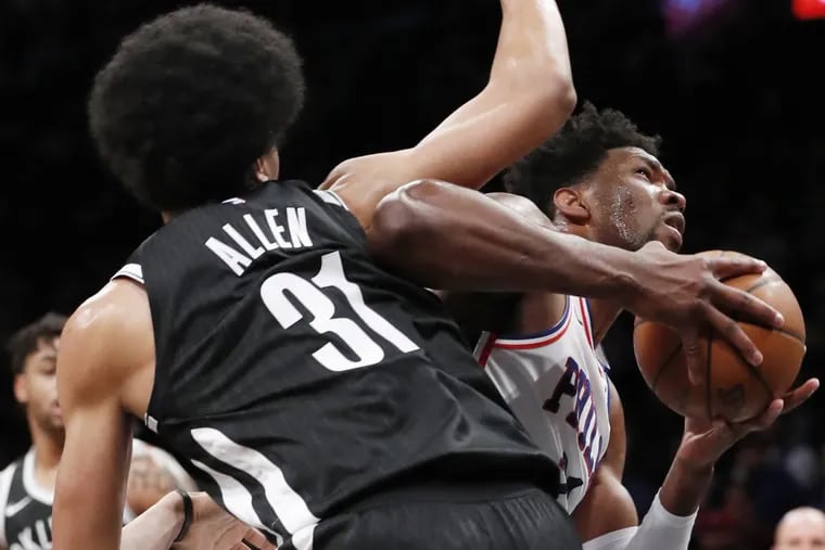 Brooklyn Nets center Jarrett Allen (31) defends Philadelphia 76ers center Joel Embiid (21) during the first half of an NBA basketball game, Sunday, March 11, 2018, in New York.