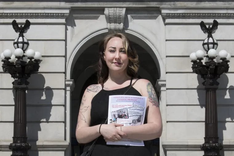 Chessa Manion, is photographed in the steps of the Pennsylvania Capitol building, minutes after a rally advocating for a change in state law to allow lawsuits for child sex abuse in Harrisburg, Pa<br/>
Tuesday, June 12, 2018. Chessa Manion, 29, was raped by the son of a Jehovah's Witness leader in Illinois when she was a small child. JOSE F. MORENO / Staff Photographer