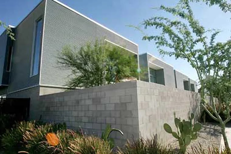 Town homes at "Galleries at Turney" are seen Wednesday in Phoenix. The ultramodern town homes are selling despite a slow housing market because of their energy efficiency and green construction. (AP Photo/Matt York)