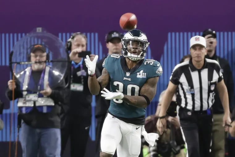 Eagles running back Corey Clement, catching the kicked-off football against the New England Patriots in Super Bowl LII, will address graduates at Rowan University on Sunday. YONG KIM / Staff Photographer