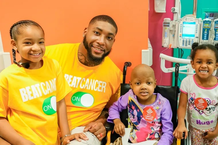 Devon Still (second from left) established the Still Strong Foundation after his daughter Leah (left) was diagnosed with a Stage IV neuroblastoma.