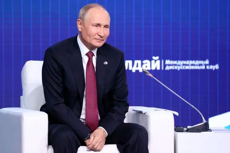 Russian President Vladimir Putin attends the plenary session of the 19th annual meeting of the Valdai International Discussion Club outside Moscow on Thursday.